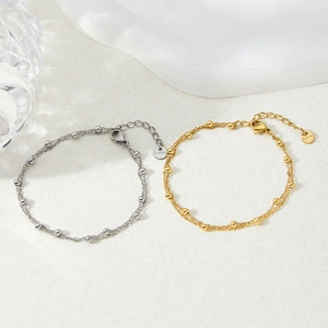 Double-layer stainless steel anklet with small gold beads in silver and gold finish