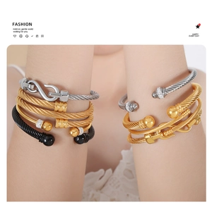 Bracelets câbles empilés en acier titane tissé doré argenté et noir avec détails en cristal