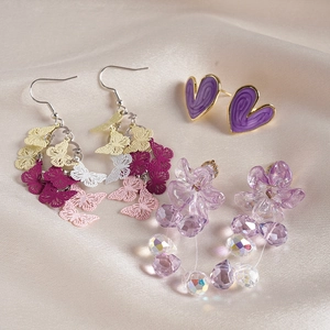 6-piece set of heart flower and butterfly drop earrings on soft beige silk fabric