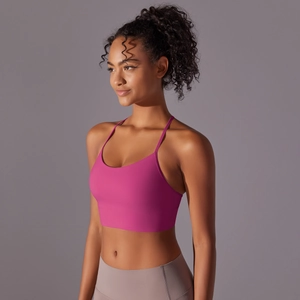 Detailed side view of rose red sports bra featuring slim straps and elastic matte fabric