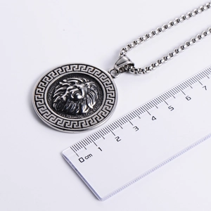 Silver round lion head pendant necklace with Greek key pattern border and 4.0cm diameter