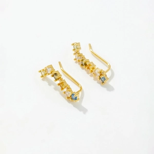 Macro shot of S925 silver double earring chain with colorful gemstones and gold plating