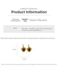 Close-up of vintage resin heart earrings with gold alloy frame and silver needles