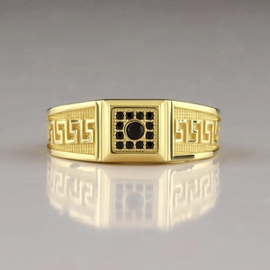 Men's gold-plated ring with black agate center and Greek key pattern on a mirror surface