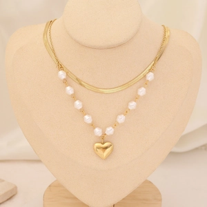 Layered gold stainless steel snake chain necklace with heart pendant and pearl accents