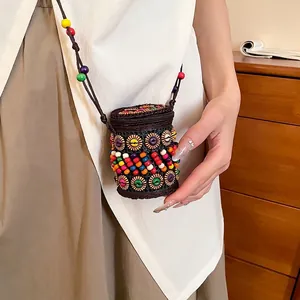 Bohemian cylindrical crossbody bag with colorful beadwork and sunflower patterns