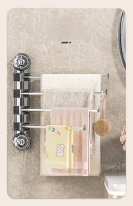 Wall-mounted rotating towel rack with four silver metal arms and marble texture base