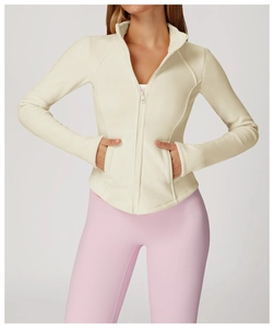 Close-up of slim-fit cream fleece jacket featuring a full zipper and stand-up collar