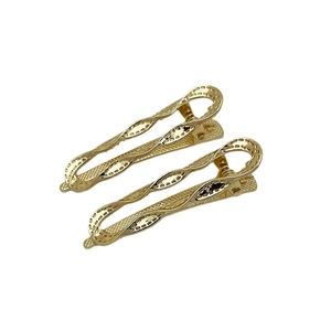 Set of two gold hollow woven geometric hair clips with a minimalist metallic finish
