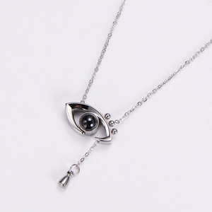 Silver angel eye memory necklace with black projection stone and teardrop pendant