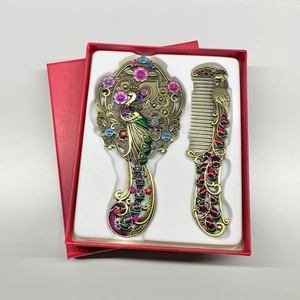 Vintage bronze peacock hand mirror and comb set decorated with enamel and rhinestones in gift box