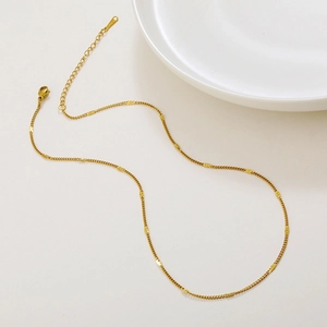 Elegant gold titanium snake chain necklace with rectangular sequins on white background