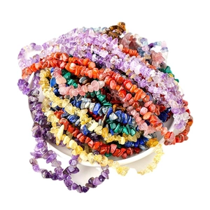 Natural irregular crystal and agate stone bead necklaces in a decorative white bowl