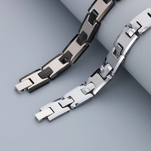 Detail of silver and two-tone black adjustable stainless steel H-link chain bracelets