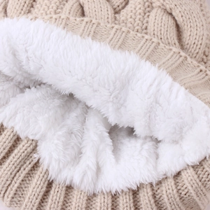 Chic beige knitted winter hat featuring thick warm fleece lining and premium texture