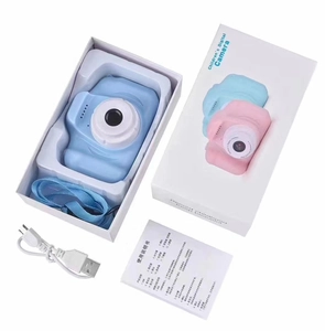 Unboxing detail of blue children digital camera with lanyard, USB cable and manual