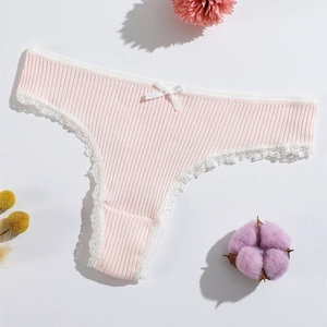 Pink ribbed lace thong with white trim and bow detail on a clean white surface