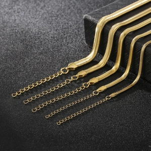 18k gold plated stainless steel flat snake chain necklaces set on black background