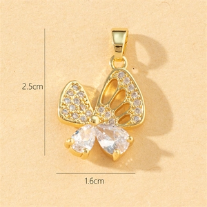 Macro detail of butterfly pendant with zirconia stones measuring 2.5cm by 1.6cm