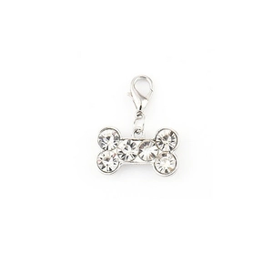 Sparkling bone-shaped dog tag with rhinestones and lobster clasp on white background