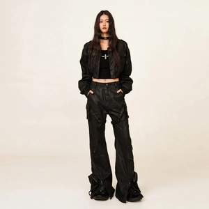 Black waxed utility cargo pants and cropped jacket set in functional industrial style