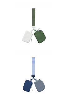 Detail view of dual-pouch waterproof nylon wristlet bags in white green and navy blue