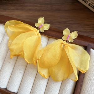 Vintage embroidered yellow floral tassel earrings with butterfly detail on tray