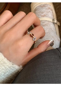 Detailed view of a retro gold chain ring featuring colorful enamel and zircon accents