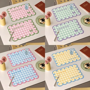 Scalloped edge checkered placemat with bow tie design in cream French style colors