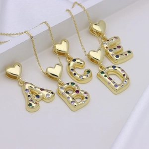 Golden 3D balloon initial necklace with colorful cubic zirconia and heart clasp