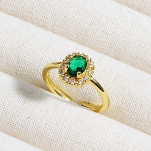 18K gold plated ring featuring oval emerald zircon with micro-pave setting on woven fabric