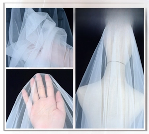 White bridal veil fabric detail showing soft texture, high transparency, and elegant drape.