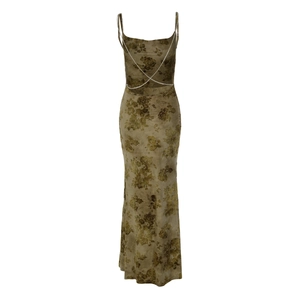 Close-up of backless tie-dye dress with rhinestone chain detail and floral pattern