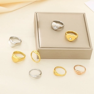 Minimalist 18K gold plated titanium rings with heart and starburst motifs in various colors