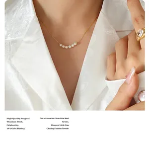 Close-up of pearl pendant necklace on model with 18k gold plated titanium steel chain