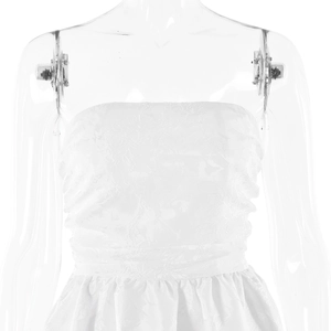 Close-up of white strapless dress featuring jacquard floral texture and pleated chest detail