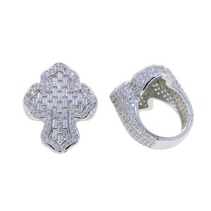 Detail of silver cross ring with pavé micro-set white cubic zirconia stones in hip hop style