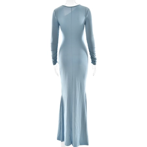 Detailed back view of a blue long sleeve dress with elegant pleats and shimmering fabric