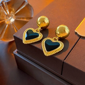 Vintage heart earrings in gold metal with black enamel inlay and woven texture
