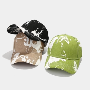 Graffiti tie-dye baseball caps in black, khaki and green with splash paint textures