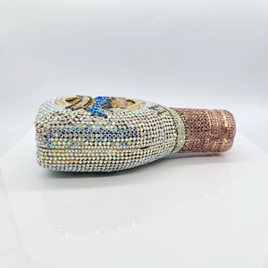 Exquisite champagne bottle evening clutch bag covered in sparkling pink and silver rhinestones
