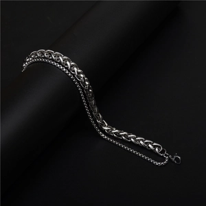 Close-up of a double-layered silver titanium steel men's chain with lobster clasp