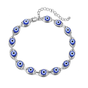 Detail of silver Evil Eye link bracelet featuring blue resin beads and lobster clasp