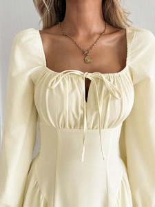 Pale yellow square neck long sleeve dress with textured pleats and drawstring waist