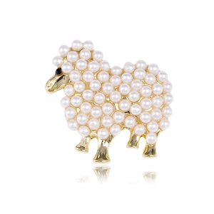 Elegant gold sheep brooch featuring white pearl fleece on a clean white background