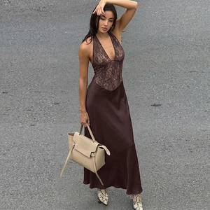 Close-up of deep brown backless lace splicing satin halter maxi dress on a model