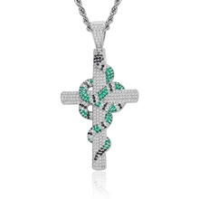 Detail of hiphop cross pendant with snake design and inlaid cubic zirconia stones