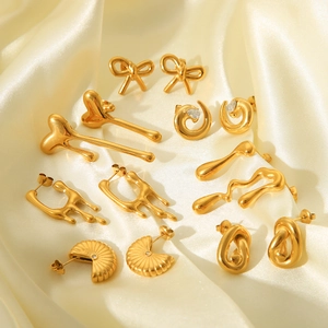 Chic 18K gold plated stainless steel earrings set with bow and heart designs on silk