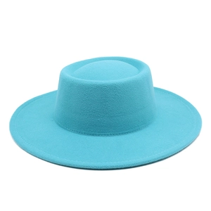 Detail view of the lake blue wool felt boater hat showing smooth fabric texture and flat brim