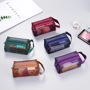 Minimalist nylon mesh coin purses in five colors with zipper closure and portable strap
